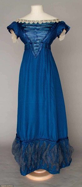 Augusta Auctions:COBALT SILK EVENING GOWN, 1820s Figured cobalt blue silk, empire bodice w/ laced V front satin panel, short cap sleeves, Lille lace trim, inset waist band, mesh puff hem trims. Front 