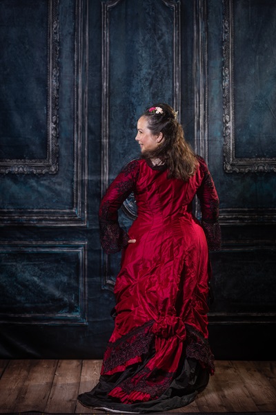 Reproduction 1878 Polonaise Natural Form Bustle - Black and Berry Silk Evening Dress. Truly Victorian TV430 and TV221. Photo by Mark Edwards.