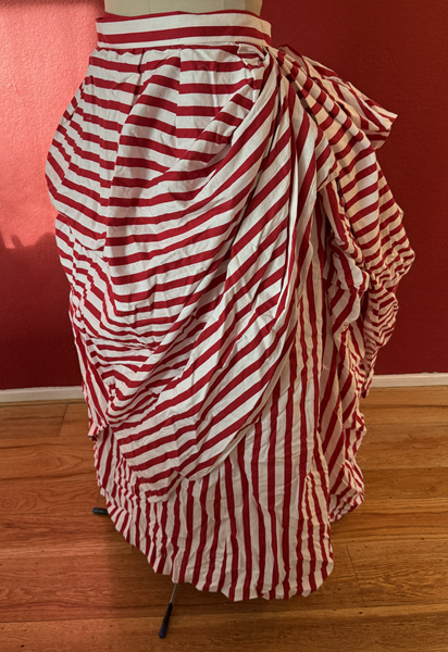 Reproduction 1887 Red Striped Overskirt Left Quarter View.Truly Victorian TV367