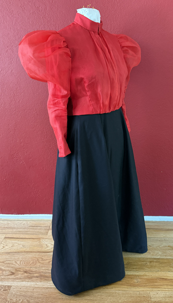 Reproduction 1890s Red Blouse and Black Skirt Right Quarter View. 