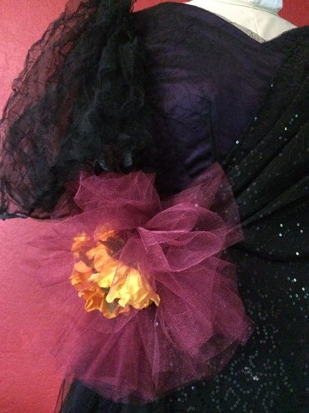 burgandy, red, black tulle with marigold flower pins