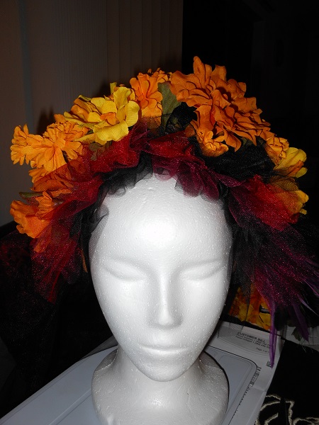 burgandy, red, black tulle with marigold flower headdress